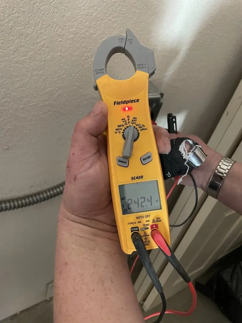 Voltage testing with clamp meter during Outlet Installation in Westminster